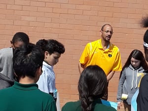 Mr Hines holding class in the courtyard